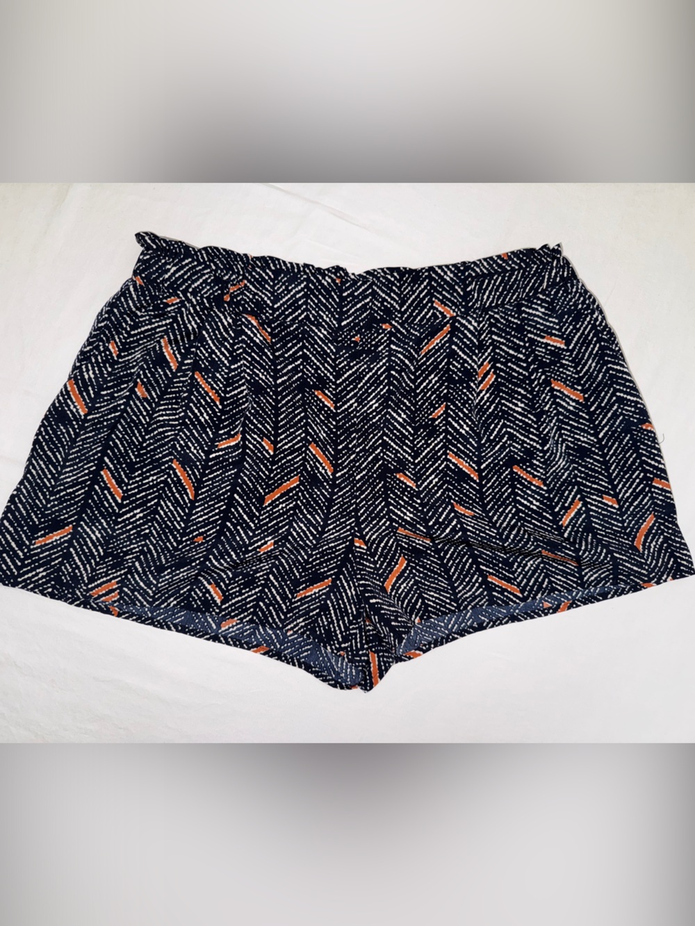 Navy Patterned Shorts with Orange Accents and Front Pockets